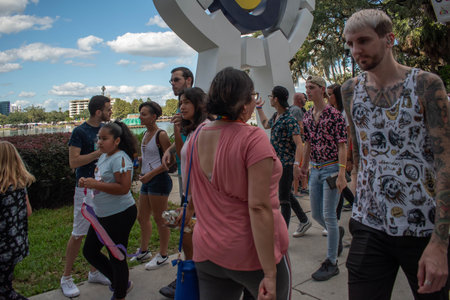 Orlando, Florida. October 12, 2019. People walking in Come Out With Pride Orlando parade at Lake...