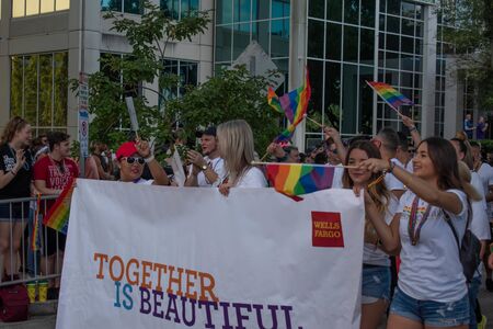 Orlando, Florida. October 12, 2019. Together is Beautiful sign in Come Out With Pride Orlando parade at Lake Eola Park area 42のeditorial素材
