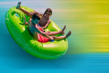 Orlando, Florida. September 20, 2019. People enjoying Karekare curl.This new ride is a curve shaped wave which riders will experience when climbing the vertical wave wall at Aquaticaのeditorial素材