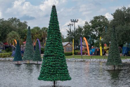 Orlando, Florida. October 24, 2019. Christmas trees on lake and Halloween decoration at Seaworld 7のeditorial素材