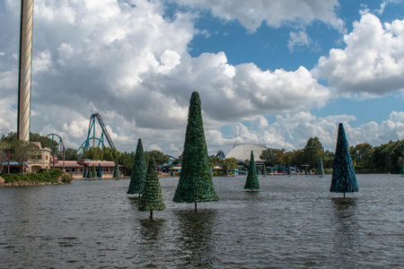 Orlando, Florida. October 24, 2019. Partial view of Sky Tower and Christmas trees on lake at...