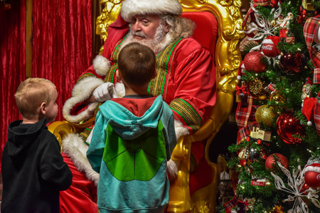 Orlando, Florida. December 25, 2018. Little brothers showing letter to Santa Claus They wrote at Seaworld 36のeditorial素材