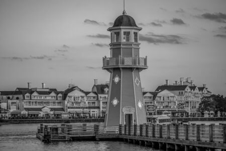 Orlando, Florida. October 11, 2019. Partial view of colorful charming buildings and lighthouse at Lake Buena Vistaのeditorial素材
