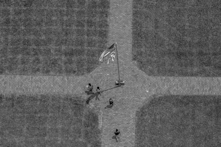Ponce de Leon Inlet, Florida. July 19, 2019 Top view of USA and Florida flags at lighthouse areaのeditorial素材