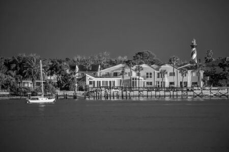 St. Augustine, Florida January 26, 2019. Colorful dockside and old lighthouse on blue sky background in Floridas Historic Coastのeditorial素材