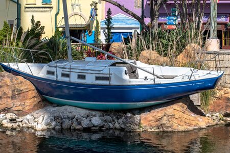 Orlando, Florida. October 29, 2019. Sail boat and colorful buidings at Seaworldのeditorial素材
