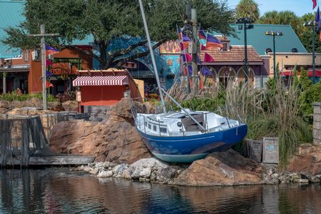 Orlando, Florida. October 29, 2019. Sailboat and colorful buildings at Seaworldのeditorial素材