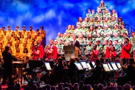 Orlando, Florida. December 03, 2019. Neil Patrick Harris telling the touching story of Christmas, accompanied by orchestra and heavenly choir in Candlelight Narrators at Epcot 45のeditorial素材