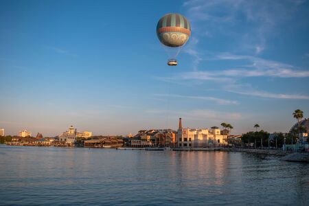 Orlando, Florida. November 29, 2019. Air balloon flying and colorful buildings in Lake Buena Vista 1のeditorial素材