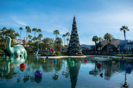 Orlando, Florida. November 27, 2019. Big dinosaur, Christmas tree and holidays decorations in Echo Lake at Hollywood Studios (25)のeditorial素材