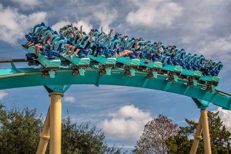 Orlando, Florida. July 28, 2021. People having fun terrific Kraken roller coaster at Seaworld (3)のeditorial素材