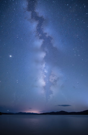 Milky Way over the lake in the mountains. Long exposure photograph.の素材