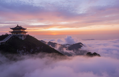 The Great Wall of China at sunrise with cloud and mist in the morningの素材