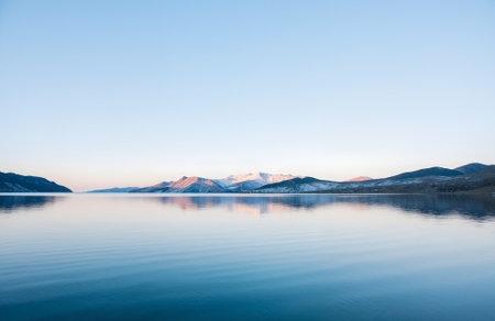 Mountains reflected in the calm water of Lake Tahoe, Nevadaの素材