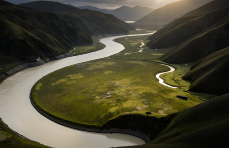 Landscape view of a river and mountains at sunset, Qinghai, Chinaの素材