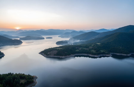Aerial view of beautiful sunset over Vacha (Antonivanovtsi) Reservoir, Rhodope Mountains, Bulgariaの素材
