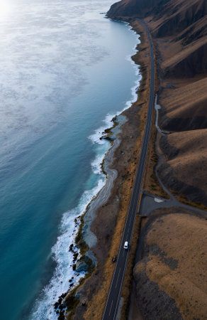 Aerial view of a road leading to the sea in Iceland.の素材