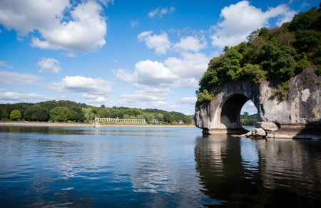 Beautiful landscape image of a lake with a stone bridge in the foregroundの素材