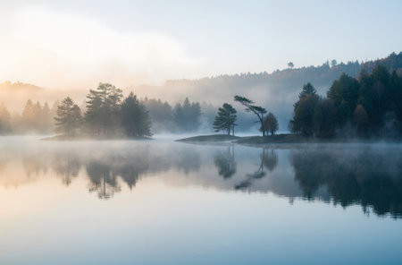 Foggy morning on the lake in autumn. Beautiful autumn landscape.の素材