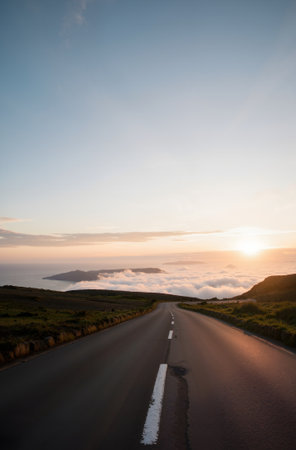 Long Empty Desert Asphalt Road in the Canary Islands Spain at Sunsetの素材
