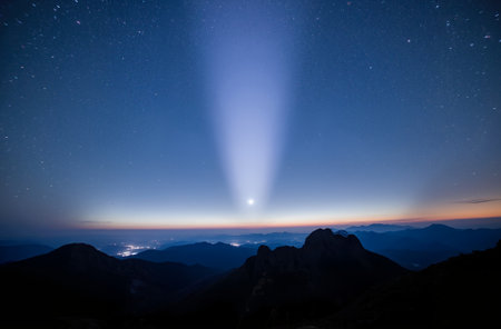 Aurora borealis in the night sky with stars in the mountainsの素材
