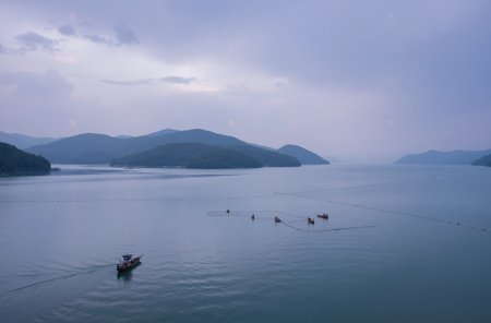 fishermen in the sea at kwai island, hong kongの素材