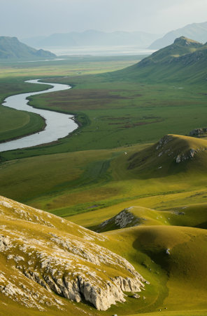 Mountain landscape in Qinghai, China. Green grassland and river.の素材