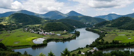 Panoramic view of Carpathian mountains and village in summerの素材