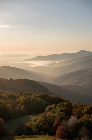 Beautiful autumn landscape in the mountains. Sunrise over the valley.の素材