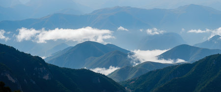 Mountain landscape in the clouds. Panoramic view of the mountains.の素材