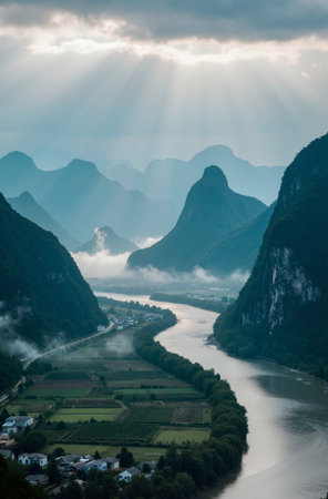 Mountain landscape with foggy valley and river in the morning.の素材