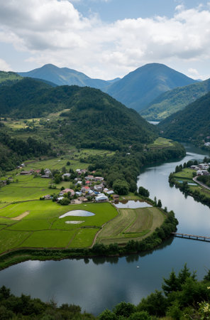 Aerial view of a small village on the shore of a mountain lakeの素材