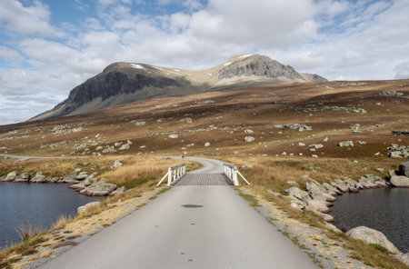 Beautiful landscape image of Glencoe in Scotland with road and lakeの素材
