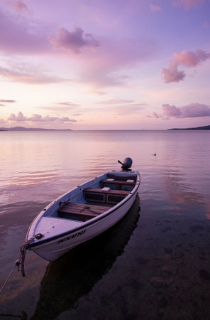 Foggy winter landscape with frozen lake and snow-covered mountainsの素材