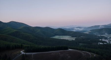 Aerial view of the road in the mountains at sunset. Carpathians, Ukraineの素材