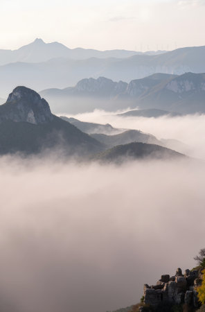 Mountain landscape with clouds and fog in autumn, closeup of photoの素材