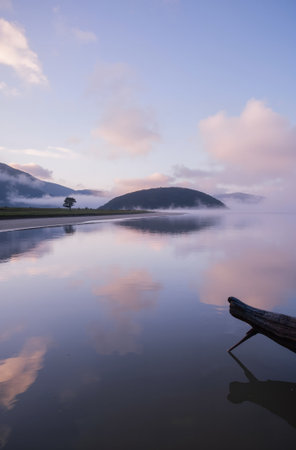 Lake in the morning with mist and fog in the foreground, Lake District, Englandの素材