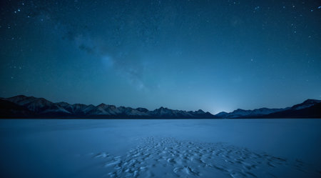 Milky Way over snowy mountains at night. Long exposure. Toned.の素材