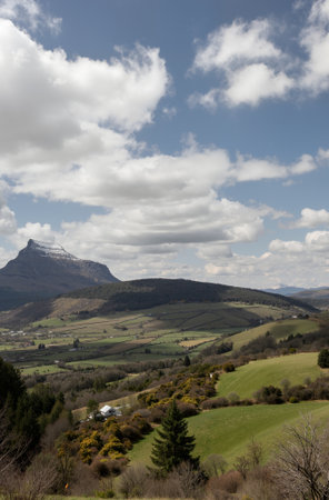 Mountain landscape with blue sky and white clouds on a sunny dayの素材