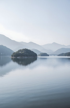 Landscape view of lake and mountains in foggy morning, South Koreaの素材