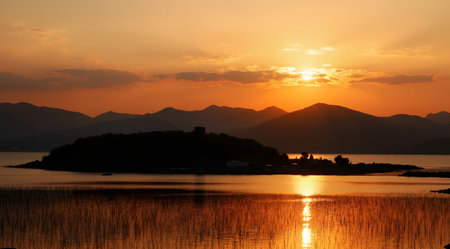 Sunset on the lake with mountains in the background, Hong Kongの素材