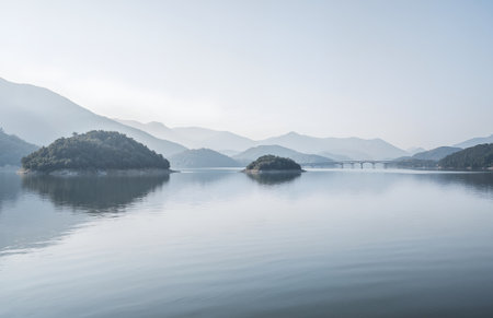 Beautiful landscape view of lake and mountain in the morning, Hangzhou, Chinaの素材