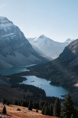Mountain landscape with blue lake and snow-capped peaks.の素材