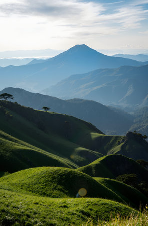 Mountain landscape with green grass and blue sky at sunset, Taiwanの素材