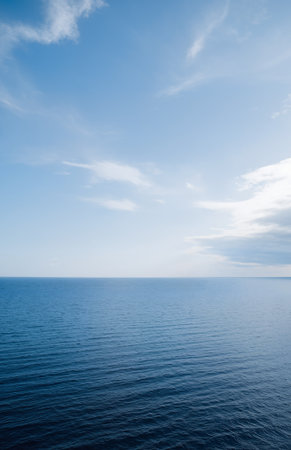 Beautiful seascape with blue sky and white clouds over the seaの素材