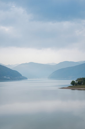 Landscape view of Lake Lugano, Switzerland in a cloudy dayの素材