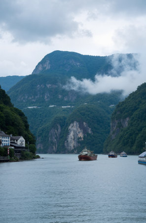 Landscape of the river and mountains in the fog in the summerの素材