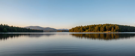 Panoramic view of a lake in the evening at sunrise.の素材