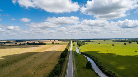 Aerial view of the road through the fields and meadows.の素材