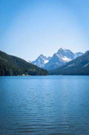 Lake with mountains in the background and blue sky, Switzerland, Europeの素材